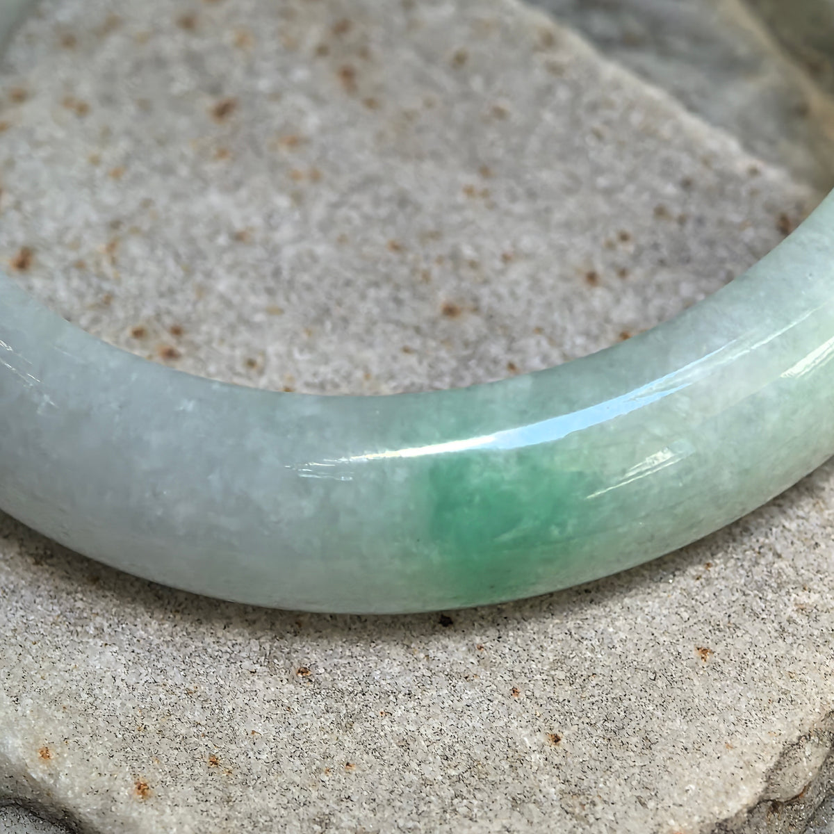 Glutinous White-Base Green Oval Jadeite Bangle – 53mm