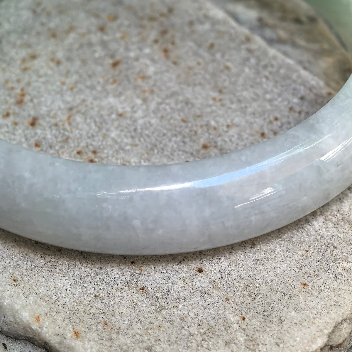 Glutinous White-Base Green Oval Jadeite Bangle – 53mm