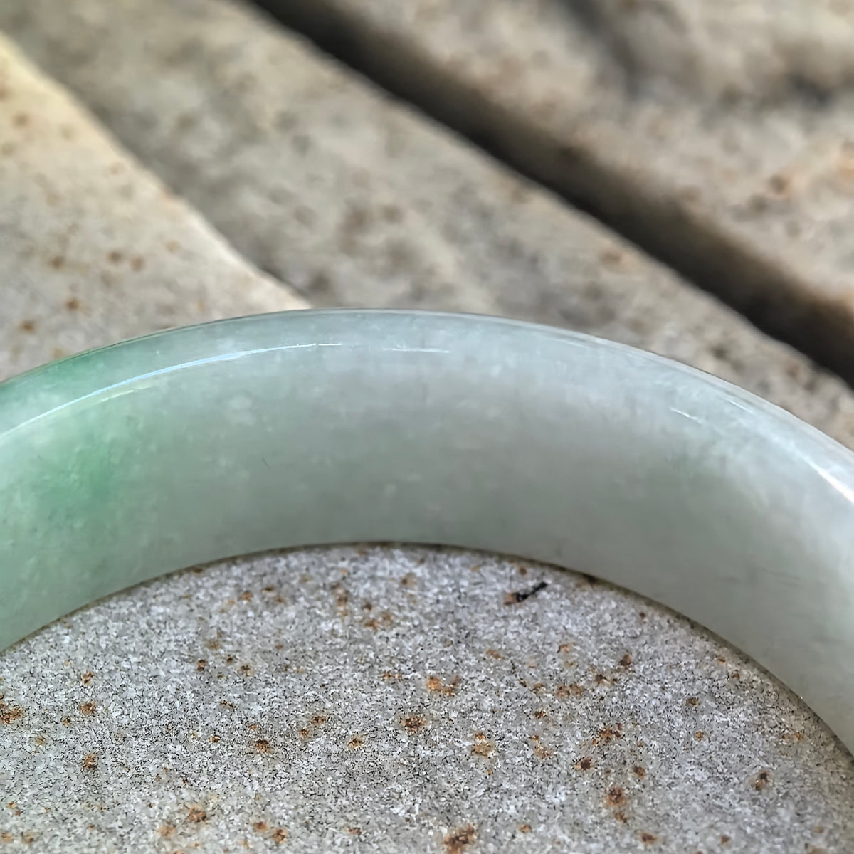 Glutinous White-Base Green Oval Jadeite Bangle – 53mm