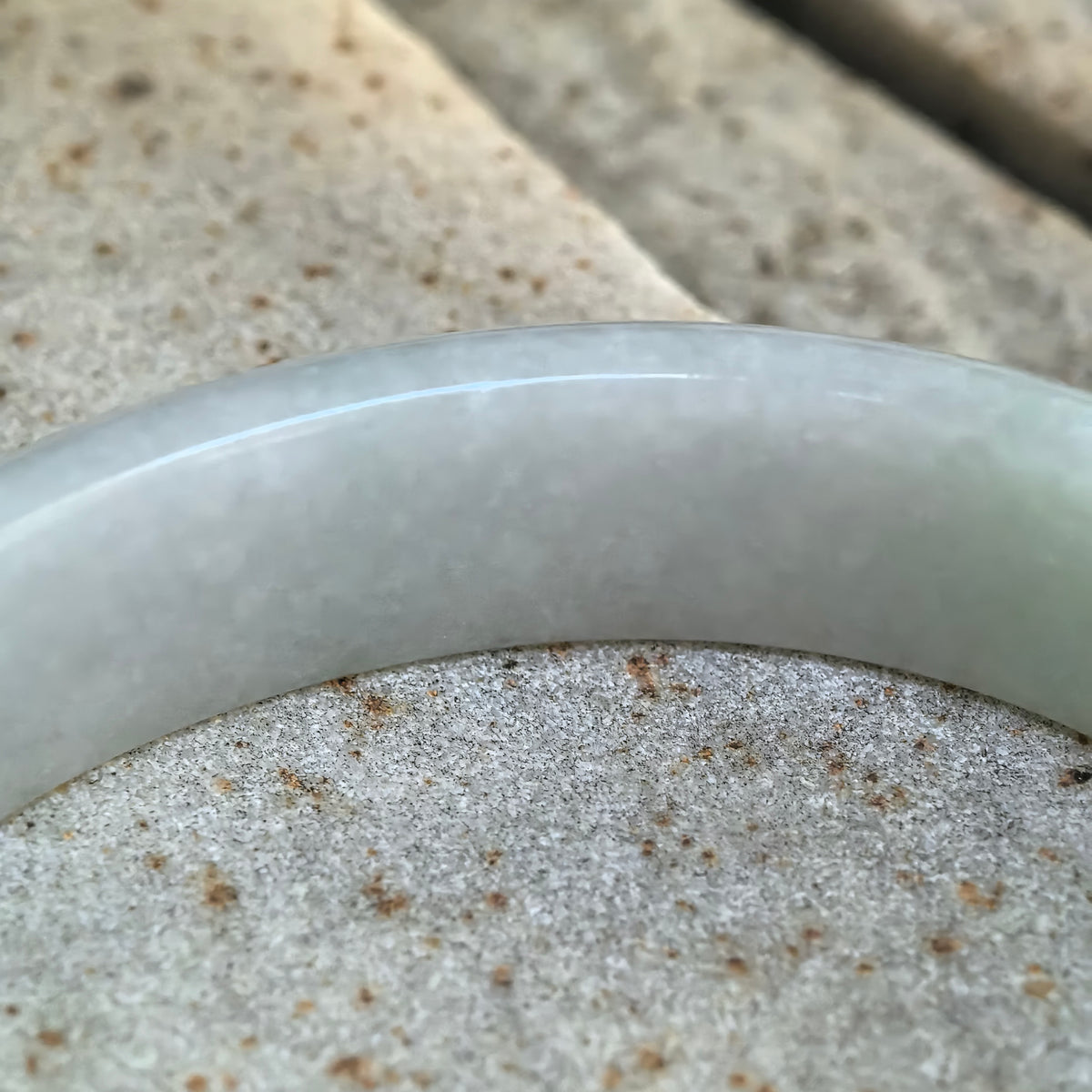 Glutinous White-Base Green Oval Jadeite Bangle – 53mm