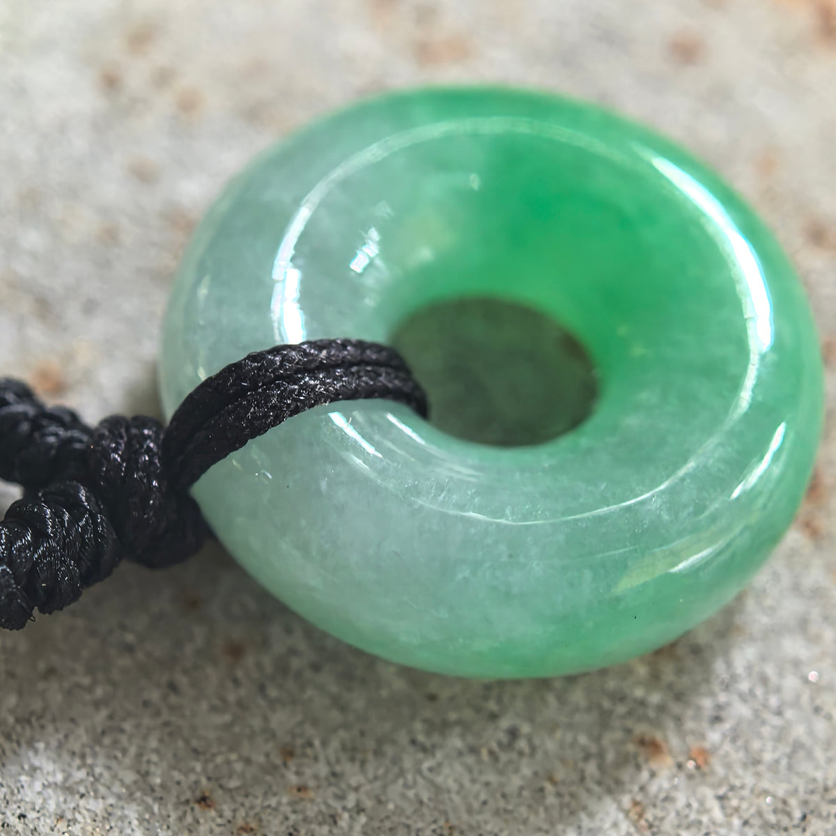 Fine Glutinous White and Green Jadeite Donut Pendant