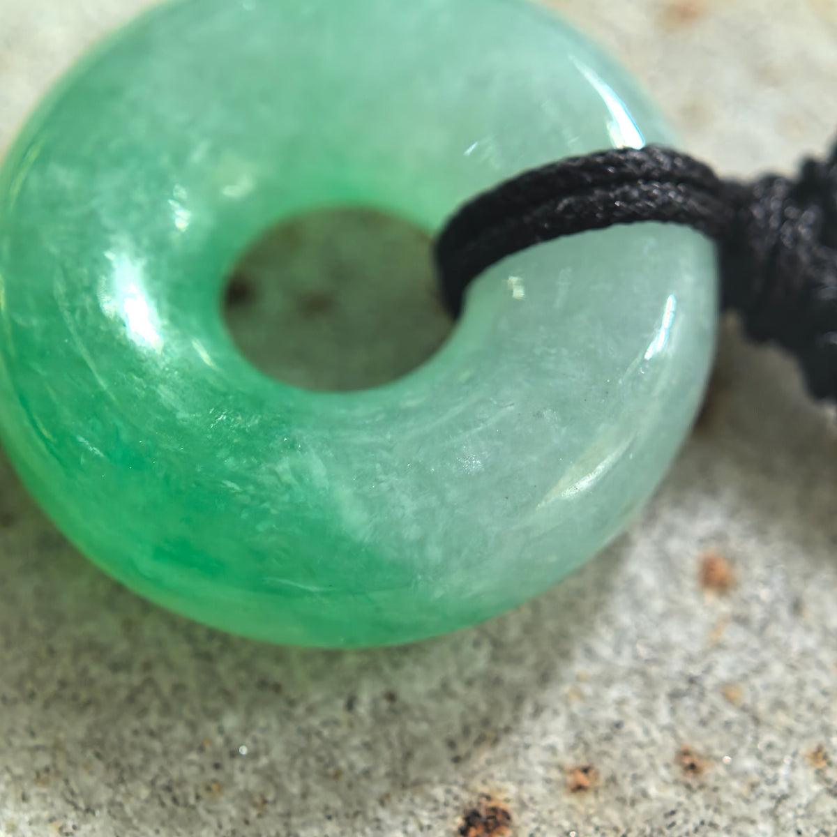 Fine Glutinous White and Green Jadeite Donut Pendant