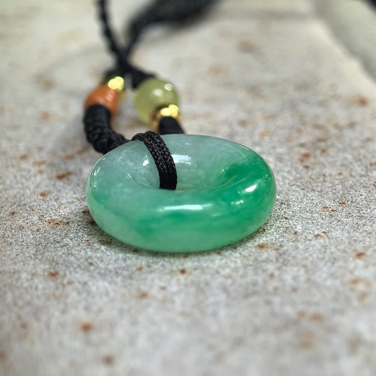 Fine Glutinous White and Green Jadeite Donut Pendant