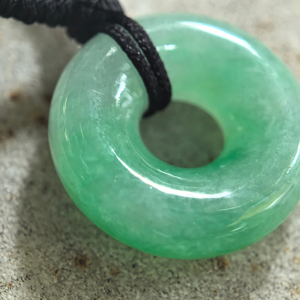Fine Glutinous White and Green Jadeite Donut Pendant