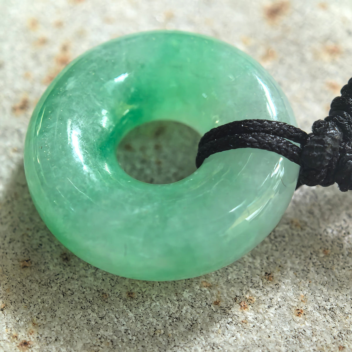 Fine Glutinous White and Green Jadeite Donut Pendant