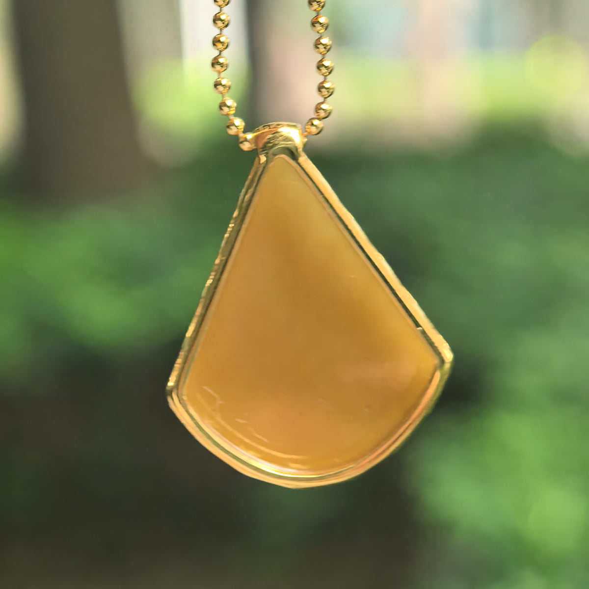 Icy Glutinous Yellow Teardrop Jadeite Pendant in 18K Gold