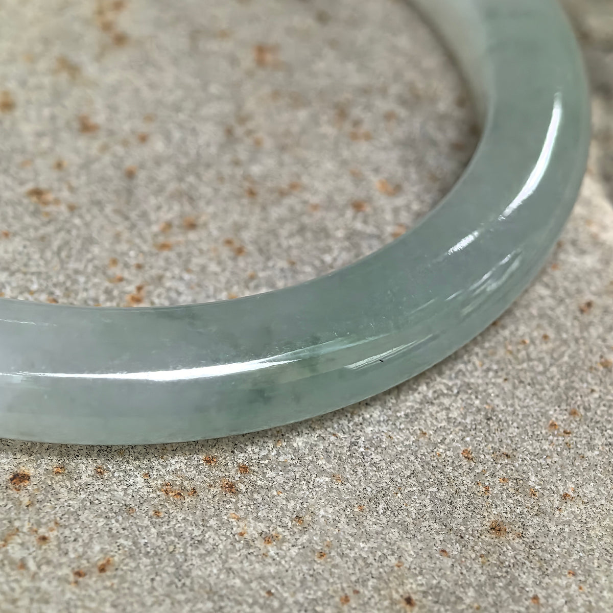 Icy Glutinous Pale Green Slim Oval Jadeite Bangle with a Green Section -53mm