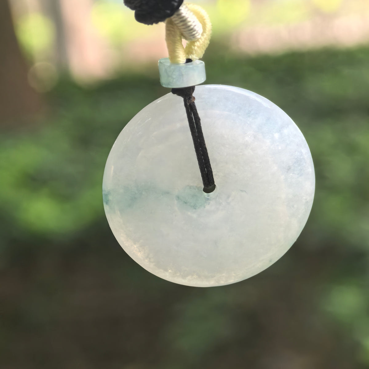 Glutinous Pale Green Jadeite Peace Pendant with Deep Green Floating Pattern