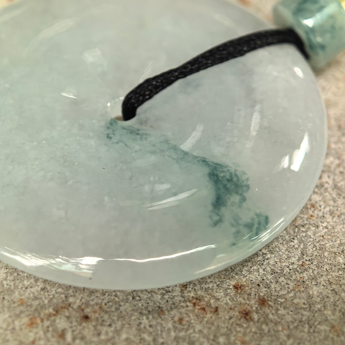 Glutinous Pale Green Jadeite Peace Pendant with Deep Green Floating Pattern