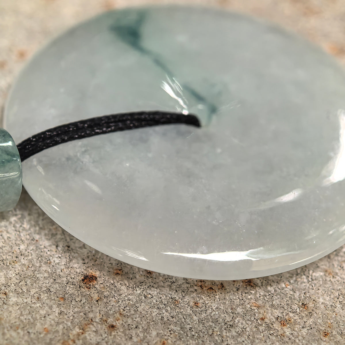 Glutinous Pale Green Jadeite Peace Pendant with Deep Green Floating Pattern