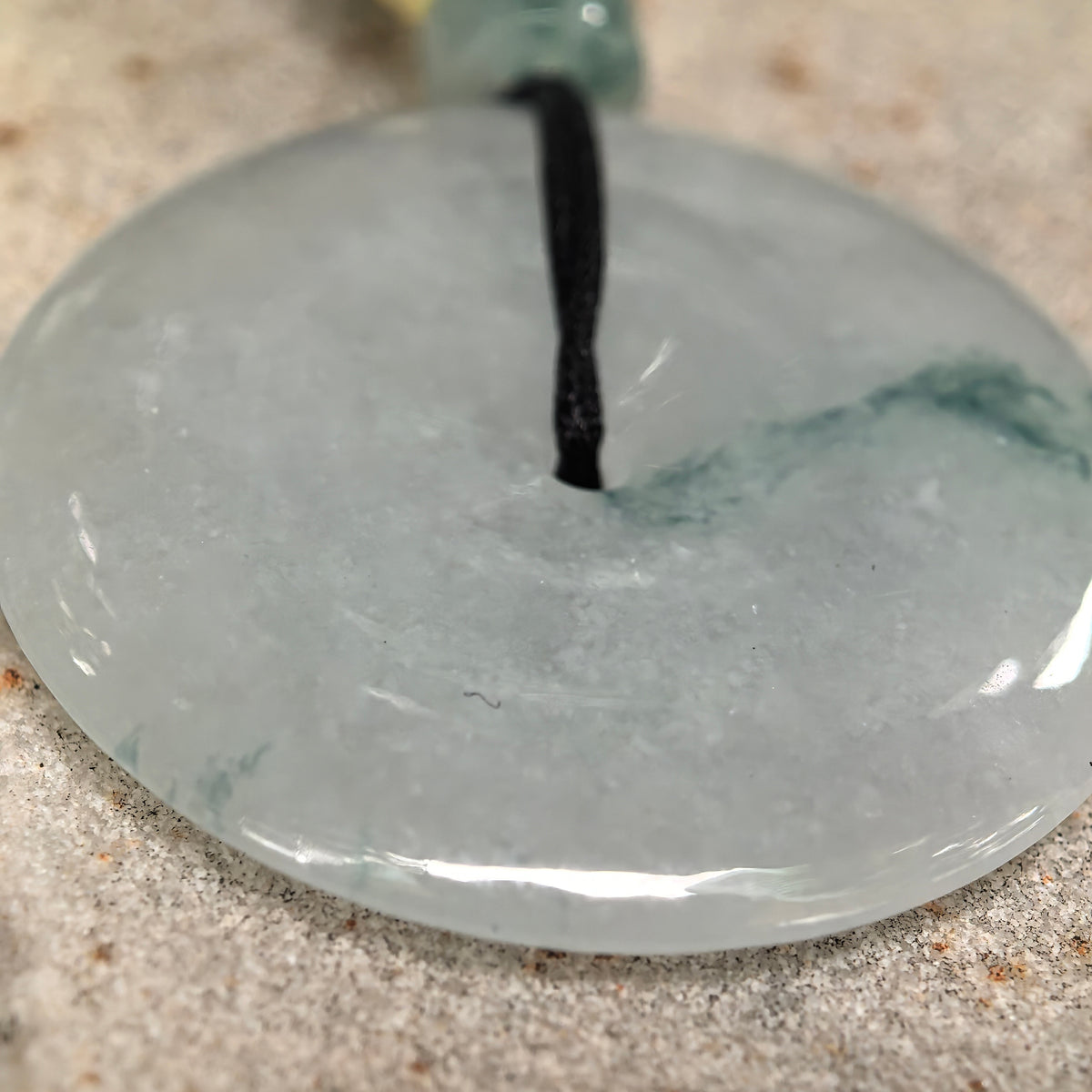 Glutinous Pale Green Jadeite Peace Pendant with Deep Green Floating Pattern