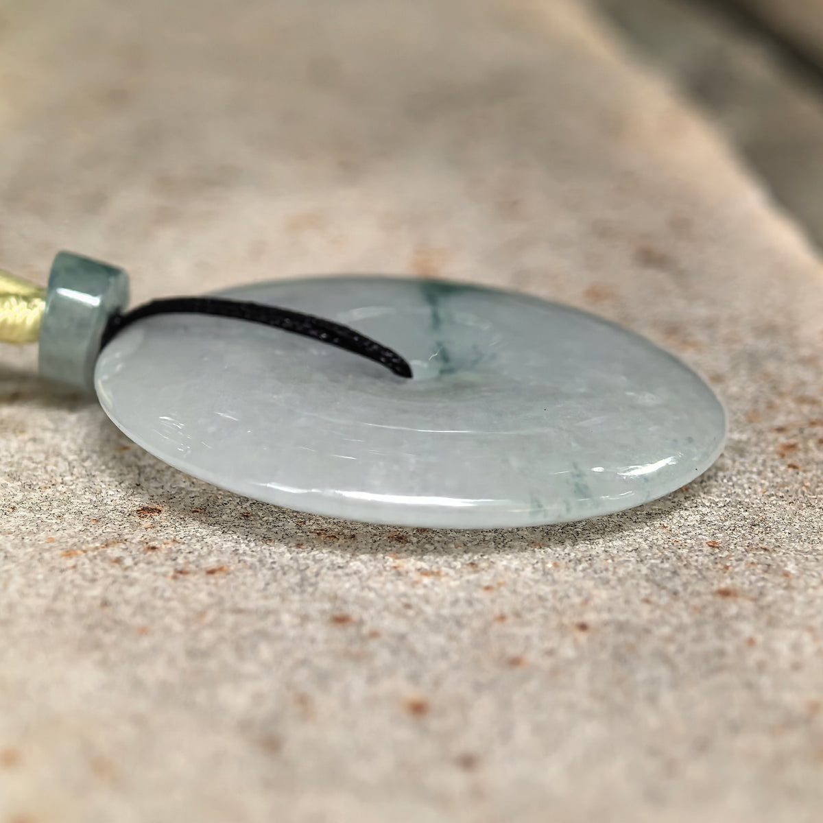 Glutinous Pale Green Jadeite Peace Pendant with Deep Green Floating Pattern