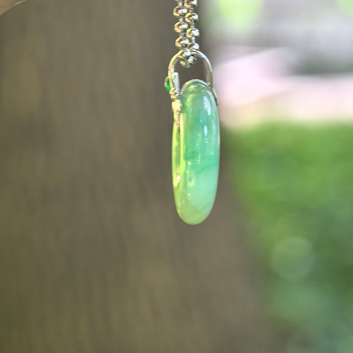 Icy Glutinous Green Jadeite Peace Pendant with Floating Patterns