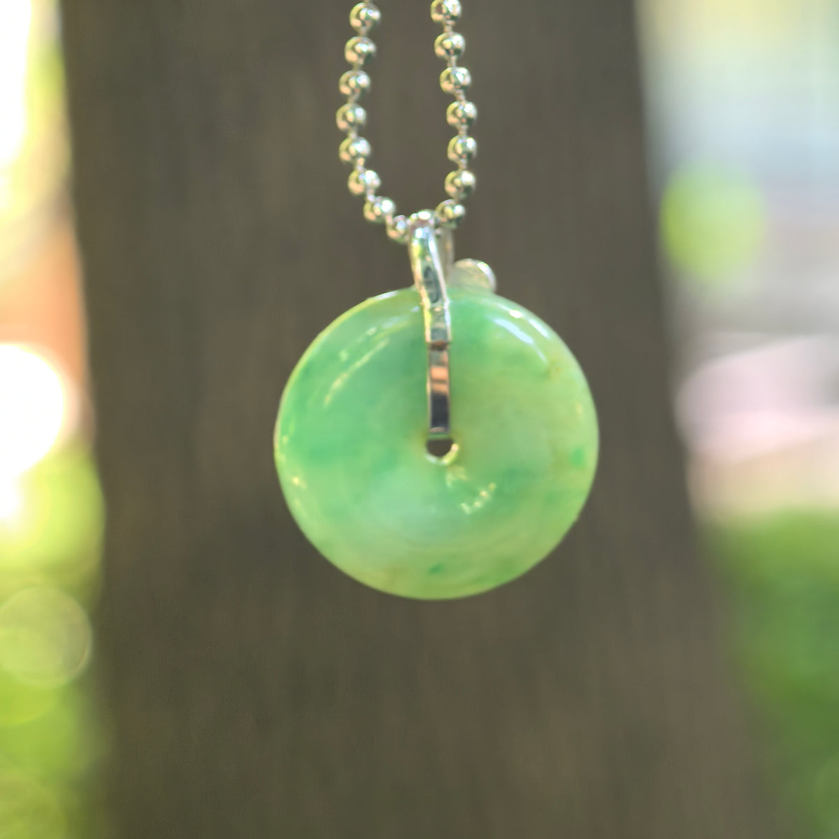 Icy Glutinous Green Jadeite Peace Pendant with Floating Patterns