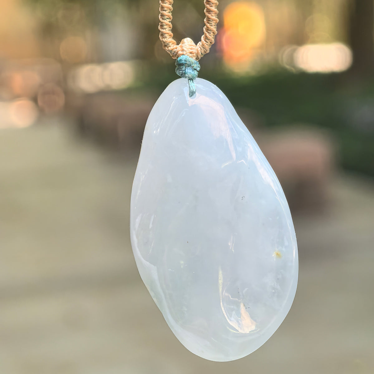 Glutinous White Jadeite Lotus and Fish Pendant with a Blue Undertone