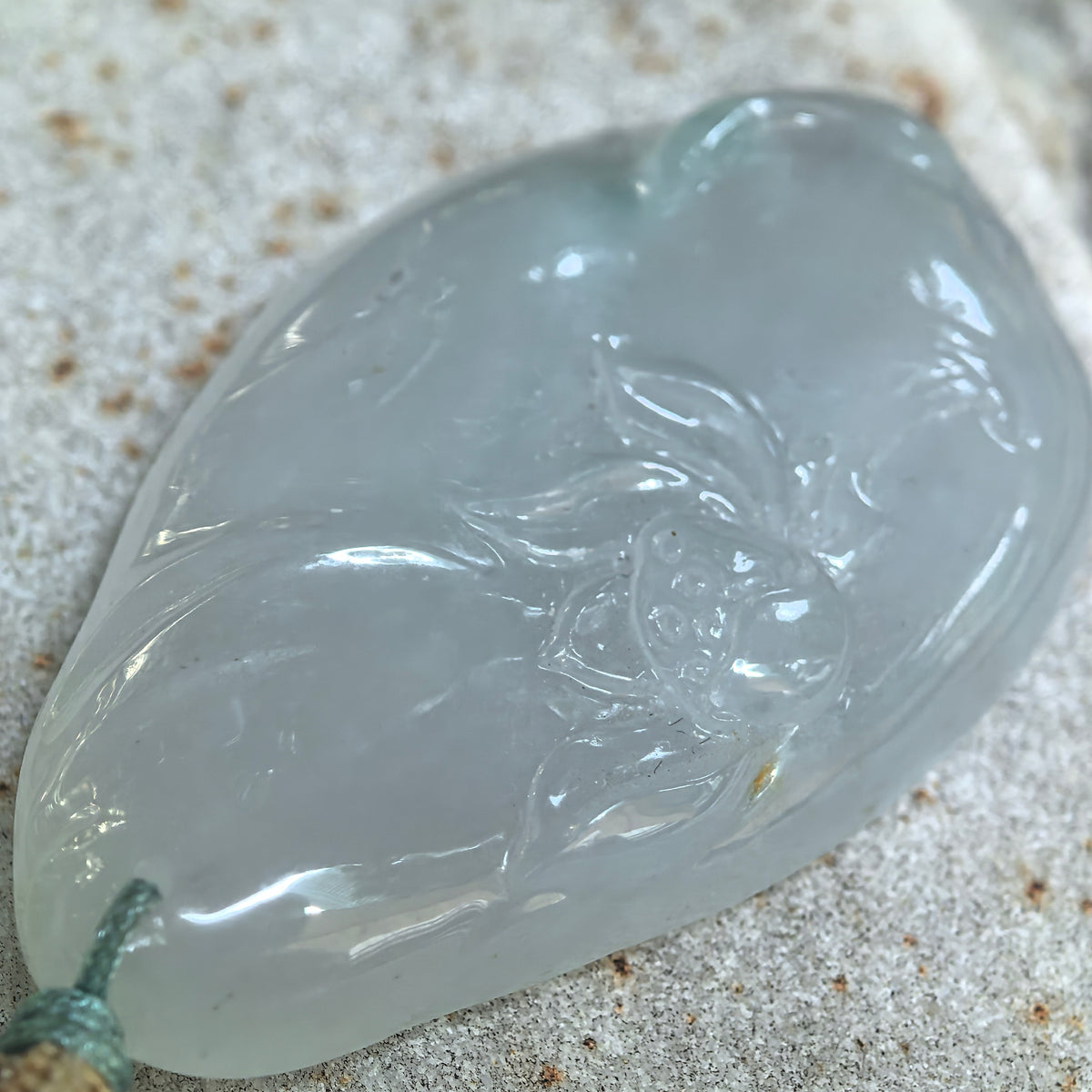 Glutinous White Jadeite Lotus and Fish Pendant with a Blue Undertone