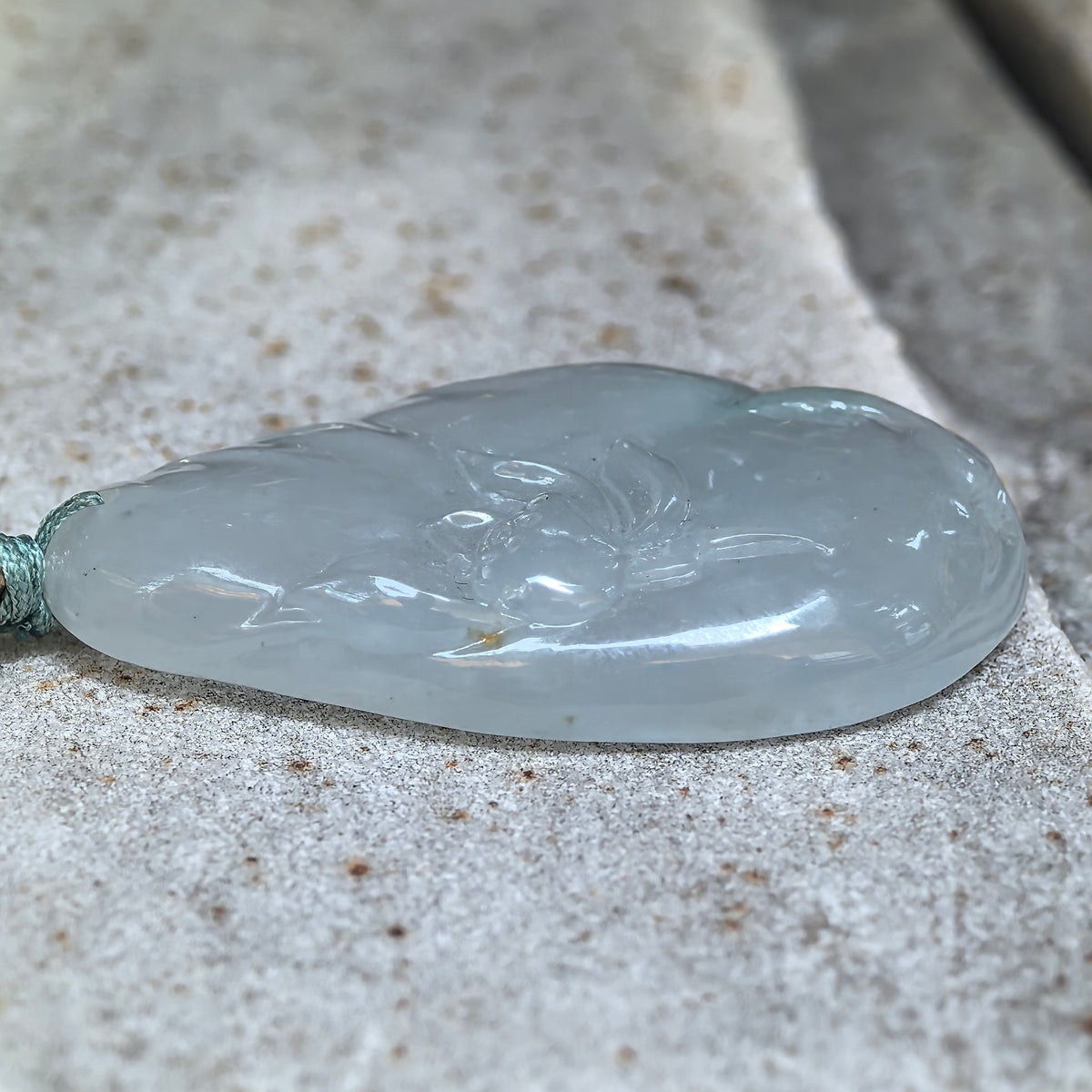 Glutinous White Jadeite Lotus and Fish Pendant with a Blue Undertone