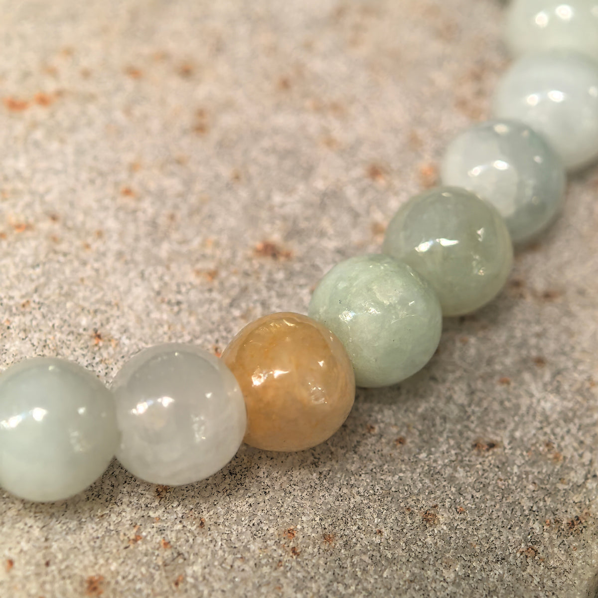 Glutinous Pale Green Jadeite Bead Bracelet with Yellow Accents · Not Sold Separately