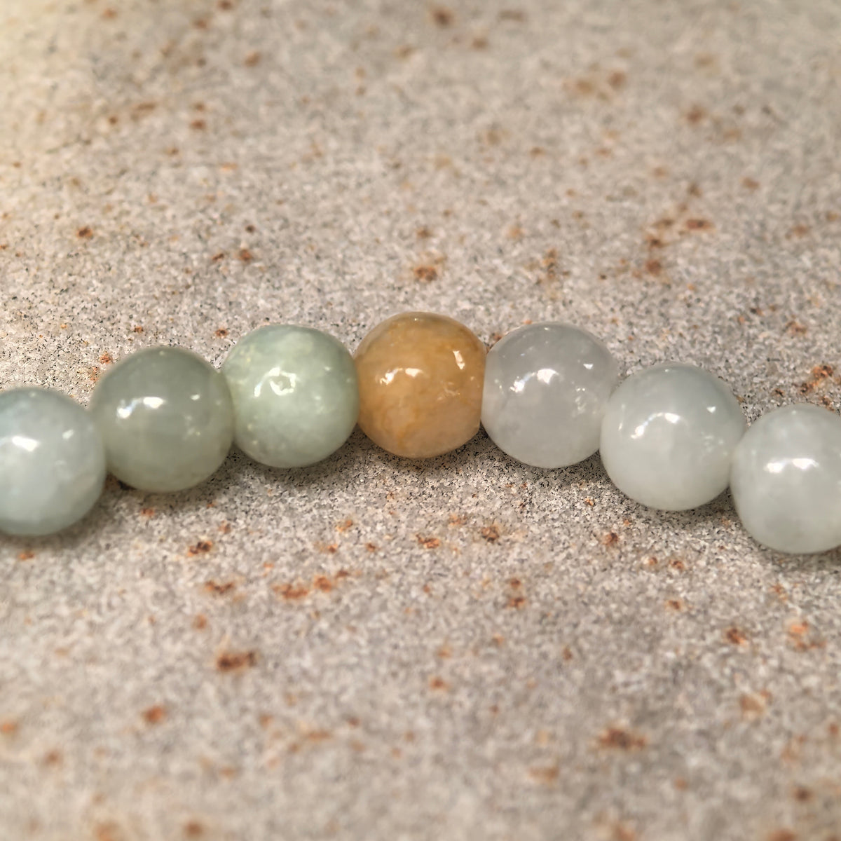 Glutinous Pale Green Jadeite Bead Bracelet with Yellow Accents · Not Sold Separately