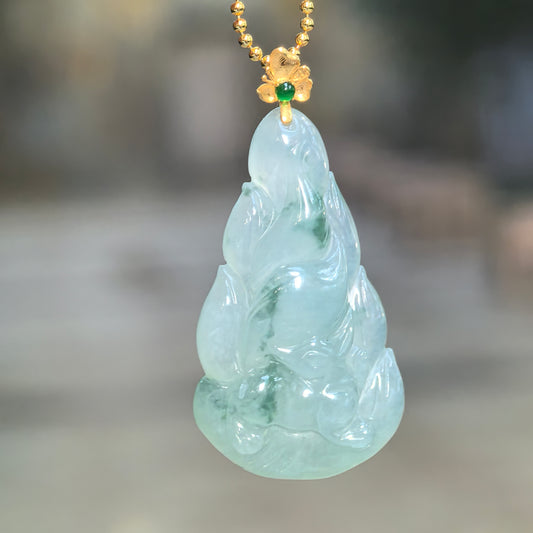 Icy glutinous light green jadeite Nine-Tailed Fox Pendant hanging from a chain, showing flowing tail carving and an 18K gold floral bail.