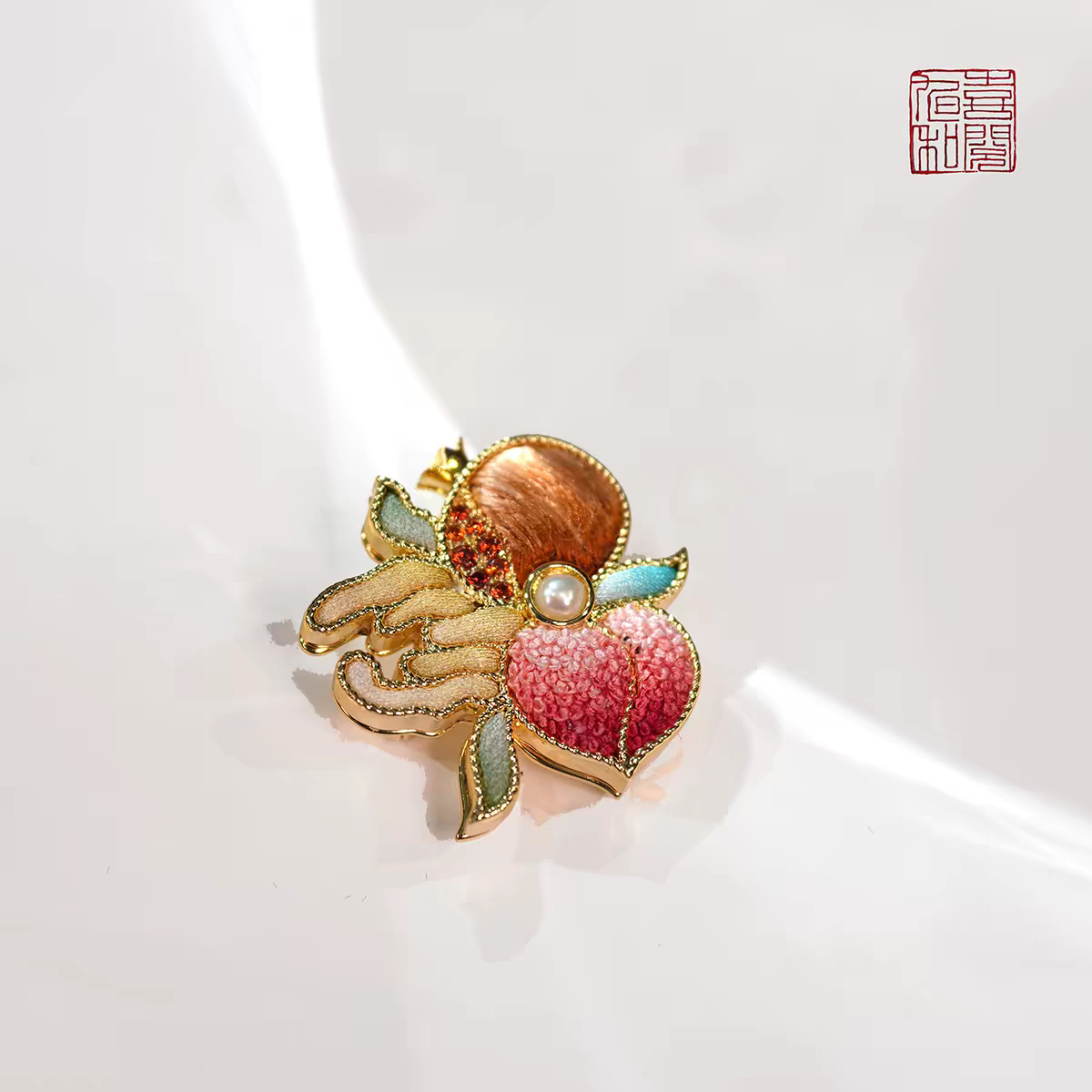 Suzhou silk embroidery Three Blessings brooch pendant with pomegranate, Buddha’s hand citron, longevity peach and central pearl detail.
